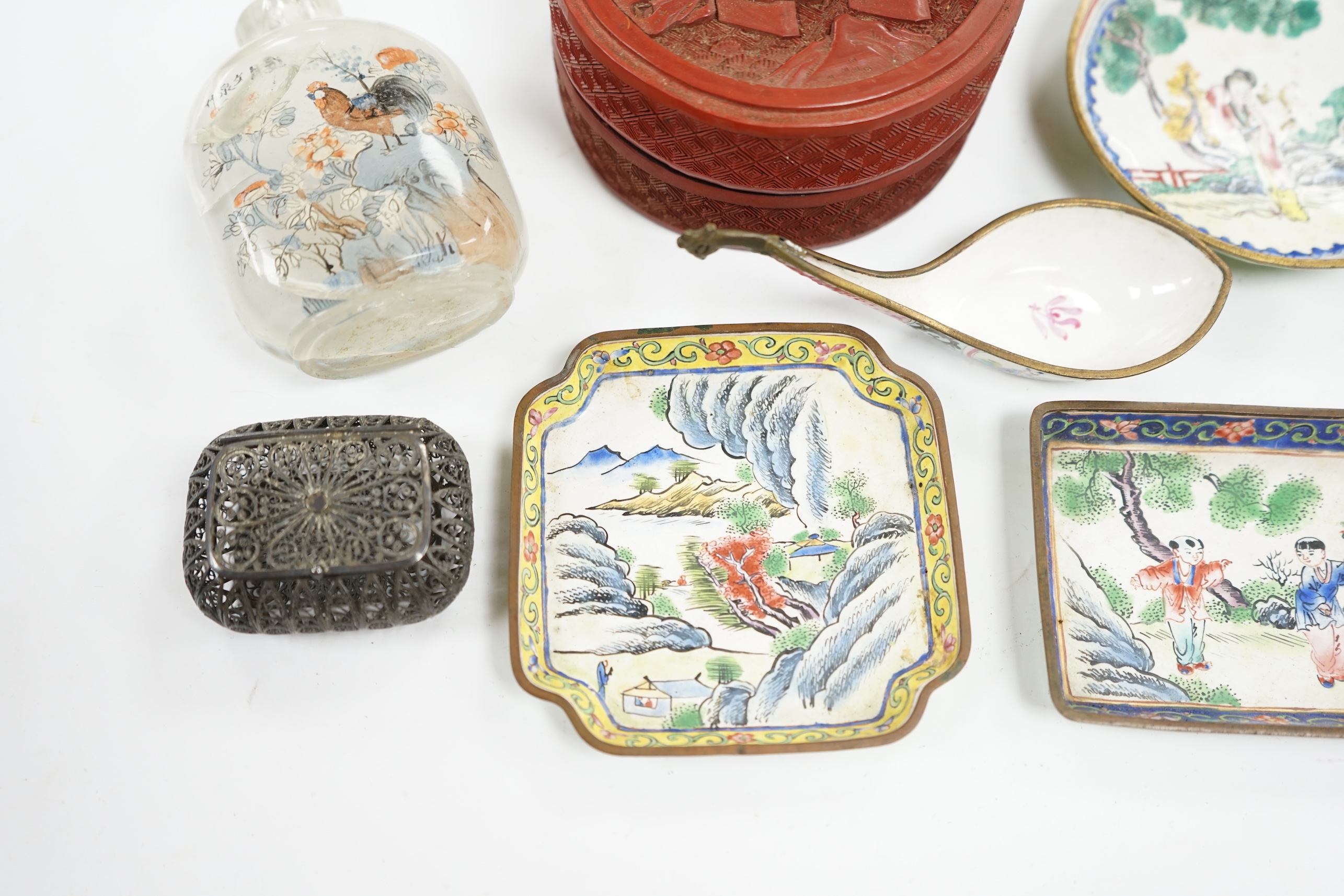 A group of Chinese Canton enamel trays, a Chinese lacquer box and cover, snuff bottles, two filigree work boxes, and a champlevé enamel box and cover, largest 10cm in diameter. Condition - varies